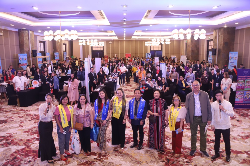 CTBEX 2026 group photo at The Bellevue Manila: CAITO ambassadors and officers with attendees on the exhibition floor